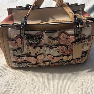 Coach dreamer with butterfly applique and snake skin detail